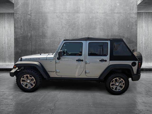 used 2014 Jeep Wrangler Unlimited car, priced at $23,154