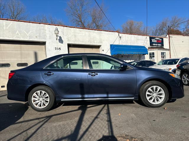 used 2014 Toyota Camry car, priced at $8,999