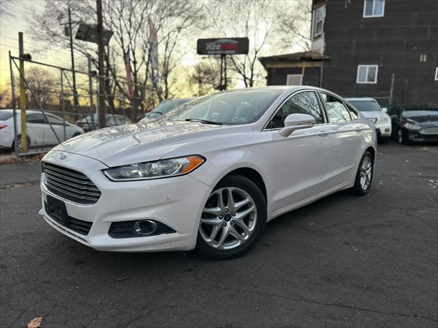 used 2014 Ford Fusion car, priced at $6,999