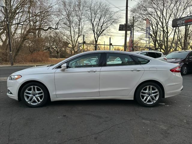 used 2014 Ford Fusion car, priced at $6,999