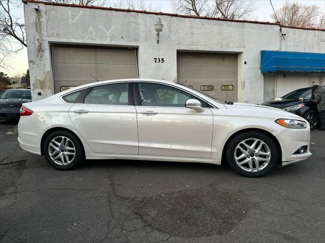 used 2014 Ford Fusion car, priced at $6,999