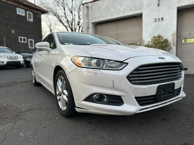 used 2014 Ford Fusion car, priced at $6,999