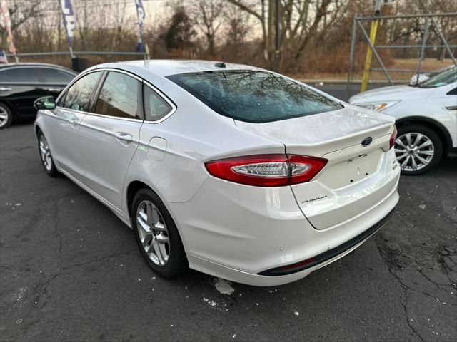 used 2014 Ford Fusion car, priced at $6,999