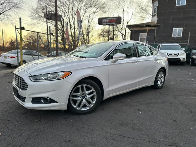 used 2014 Ford Fusion car, priced at $6,999