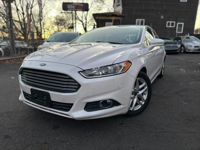 used 2014 Ford Fusion car, priced at $6,999