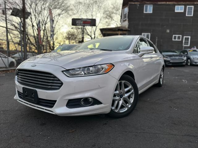 used 2014 Ford Fusion car, priced at $6,999