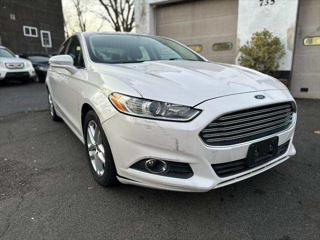 used 2014 Ford Fusion car, priced at $6,999