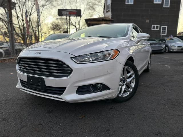 used 2014 Ford Fusion car, priced at $6,999