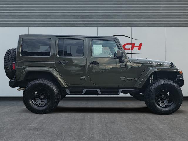 used 2015 Jeep Wrangler Unlimited car, priced at $23,411