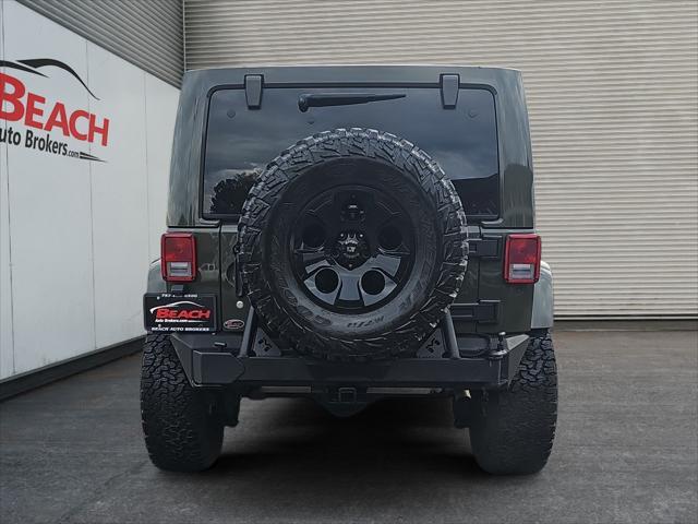 used 2015 Jeep Wrangler Unlimited car, priced at $23,411