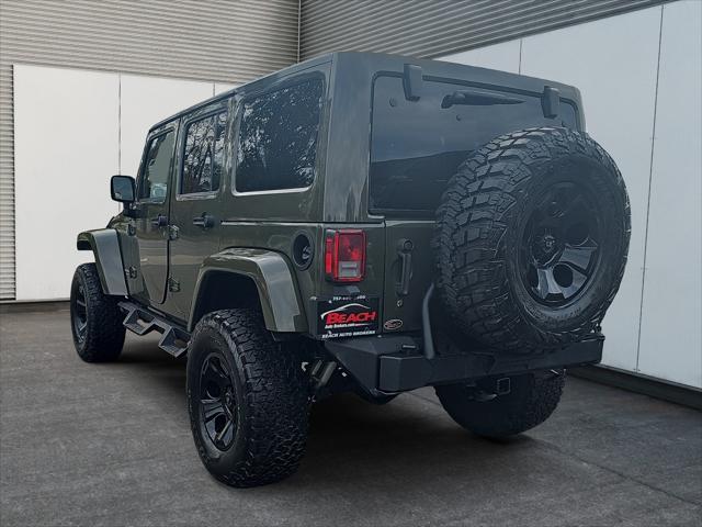 used 2015 Jeep Wrangler Unlimited car, priced at $23,411