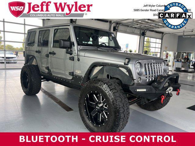 used 2014 Jeep Wrangler Unlimited car, priced at $19,879