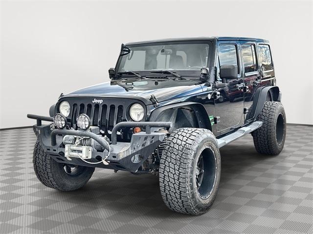 used 2013 Jeep Wrangler Unlimited car, priced at $16,699