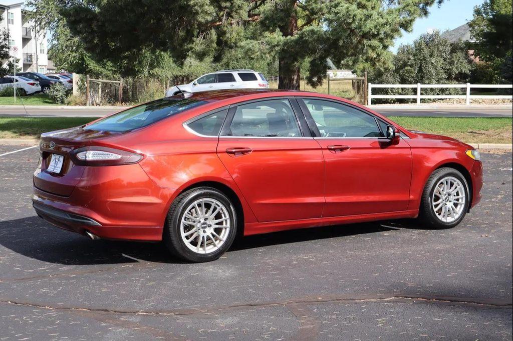 used 2014 Ford Fusion car, priced at $7,999