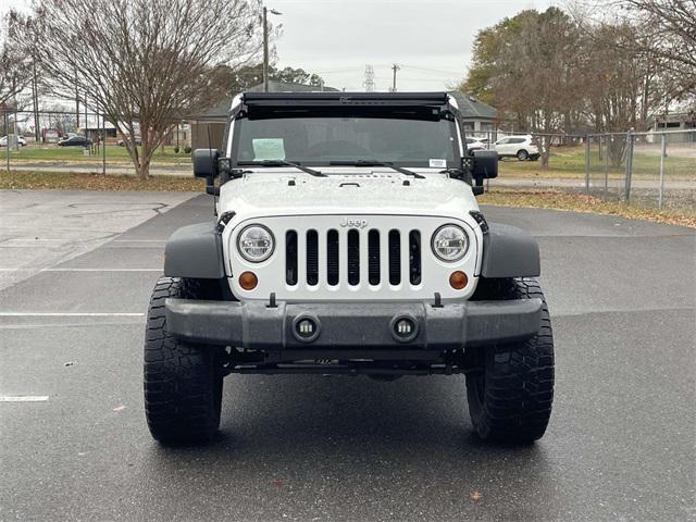 used 2013 Jeep Wrangler Unlimited car, priced at $11,599