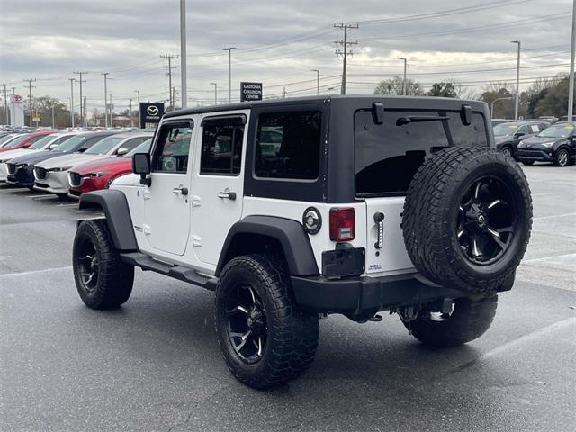 used 2013 Jeep Wrangler Unlimited car, priced at $11,599