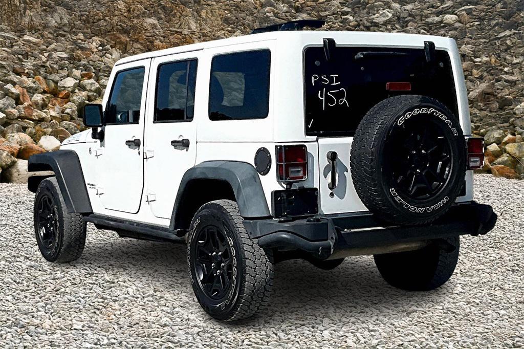used 2013 Jeep Wrangler Unlimited car, priced at $13,495