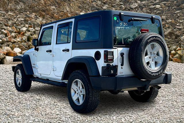 used 2014 Jeep Wrangler Unlimited car, priced at $13,995