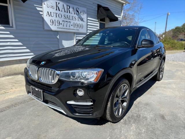 used 2018 BMW X4 car, priced at $17,499