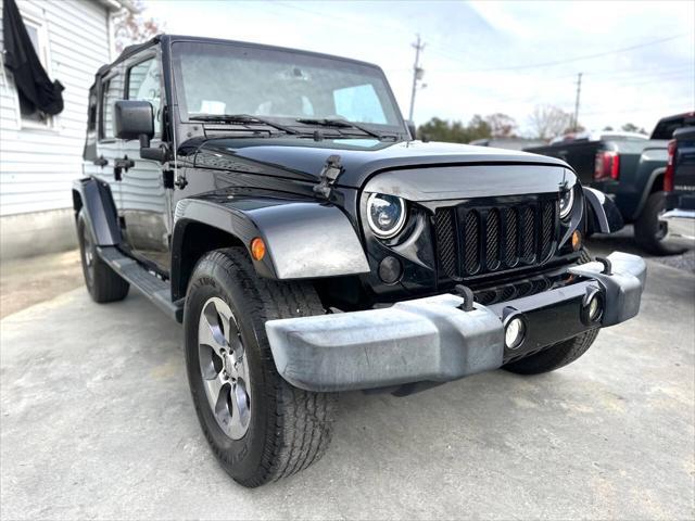 used 2016 Jeep Wrangler Unlimited car, priced at $16,999