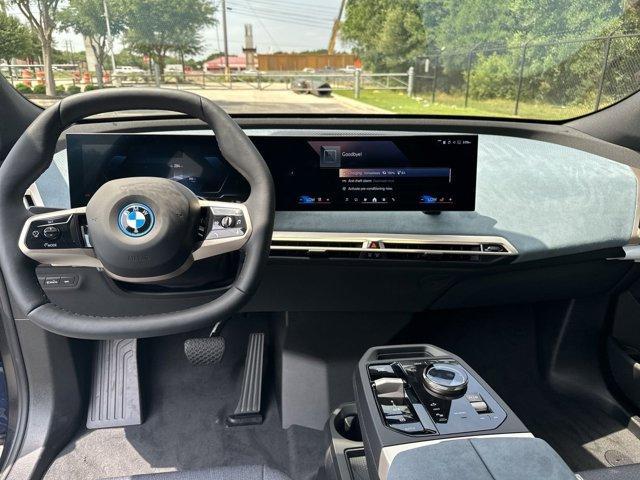 new 2024 BMW iX car, priced at $93,345