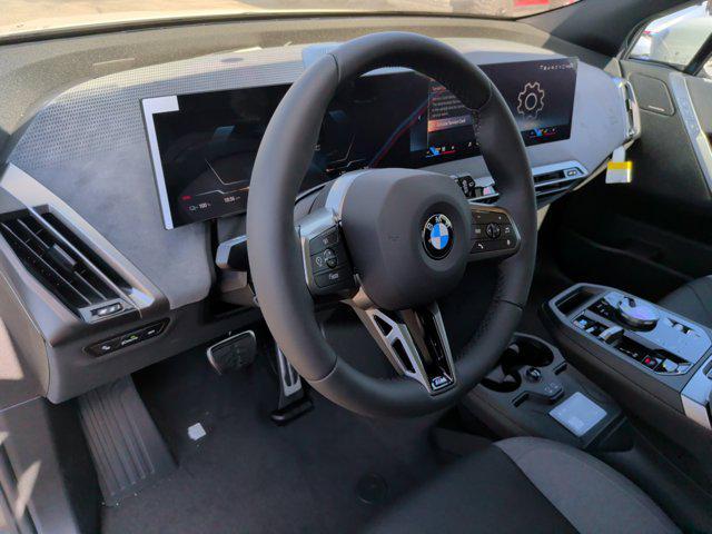 new 2026 BMW iX car, priced at $90,070
