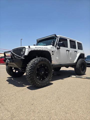 used 2013 Jeep Wrangler Unlimited car, priced at $26,991