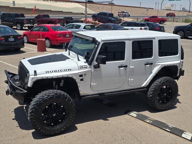 used 2013 Jeep Wrangler Unlimited car, priced at $26,991