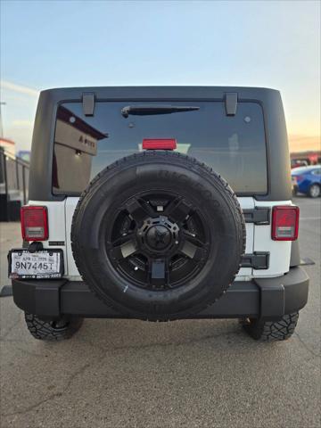 used 2014 Jeep Wrangler Unlimited car, priced at $21,991