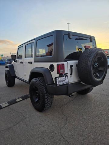 used 2014 Jeep Wrangler Unlimited car, priced at $21,991