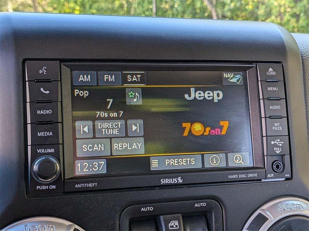 used 2014 Jeep Wrangler Unlimited car, priced at $18,290