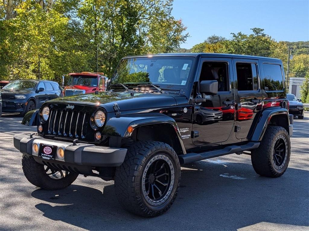 used 2014 Jeep Wrangler Unlimited car, priced at $18,290