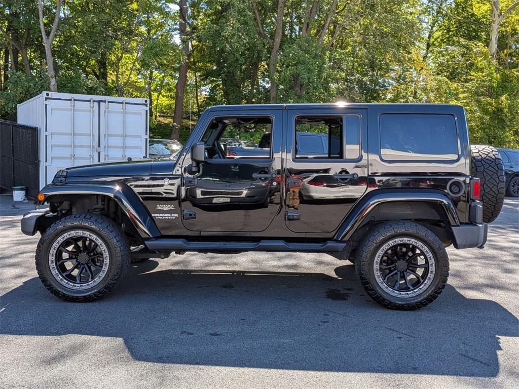 used 2014 Jeep Wrangler Unlimited car, priced at $18,290
