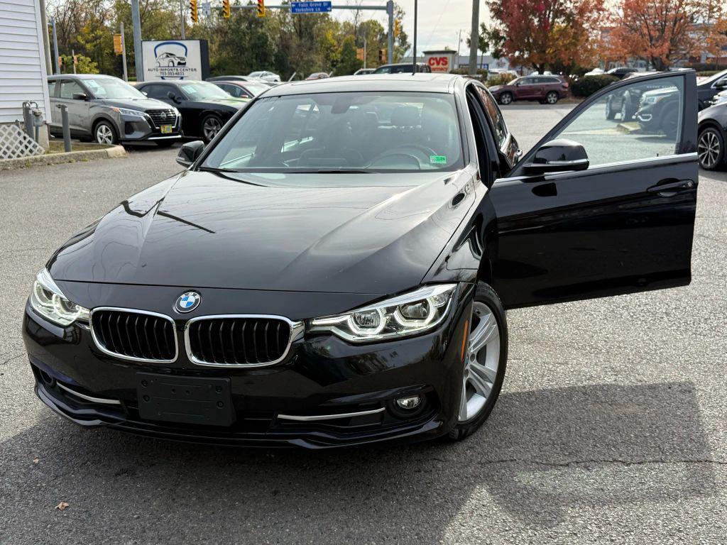 used 2018 BMW 330 car, priced at $13,999