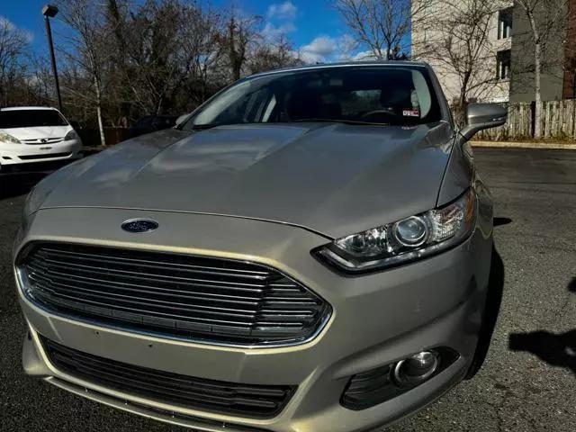 used 2015 Ford Fusion car, priced at $10,299