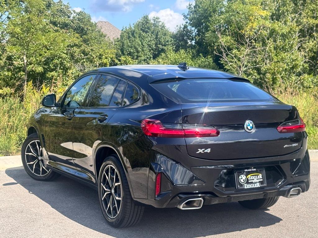 used 2025 BMW X4 car, priced at $52,099