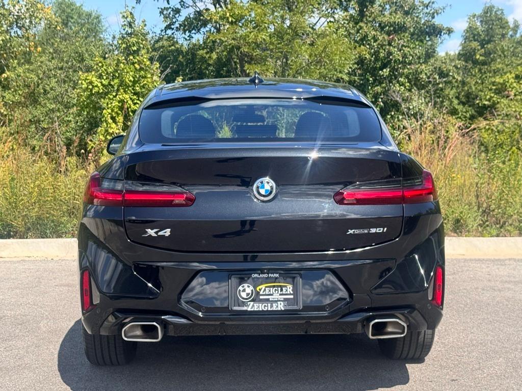 used 2025 BMW X4 car, priced at $52,099