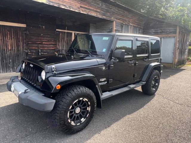 used 2011 Jeep Wrangler Unlimited car, priced at $13,499