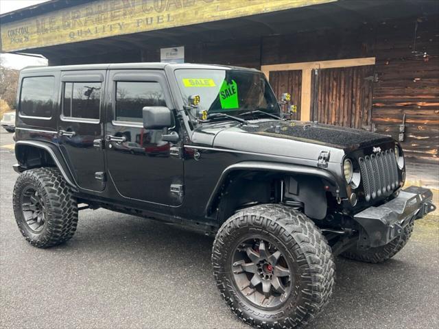 used 2014 Jeep Wrangler Unlimited car, priced at $16,499