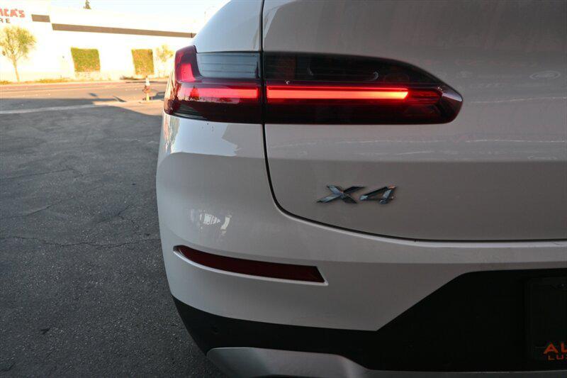 used 2023 BMW X4 car, priced at $34,495
