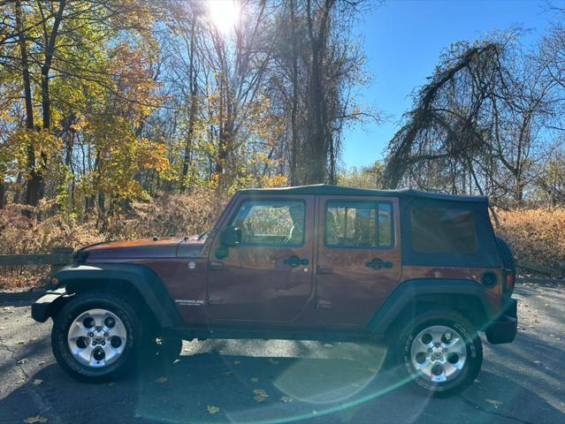 used 2010 Jeep Wrangler Unlimited car, priced at $11,999