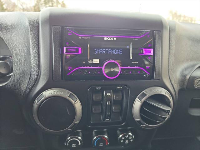 used 2014 Jeep Wrangler Unlimited car, priced at $18,495