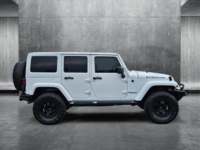 used 2012 Jeep Wrangler Unlimited car, priced at $16,786