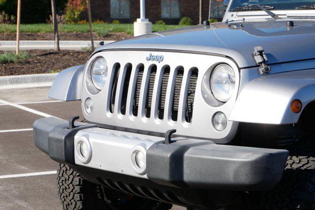 used 2015 Jeep Wrangler Unlimited car, priced at $17,289