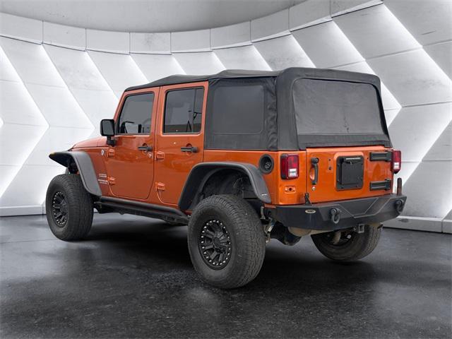 used 2011 Jeep Wrangler Unlimited car, priced at $15,477