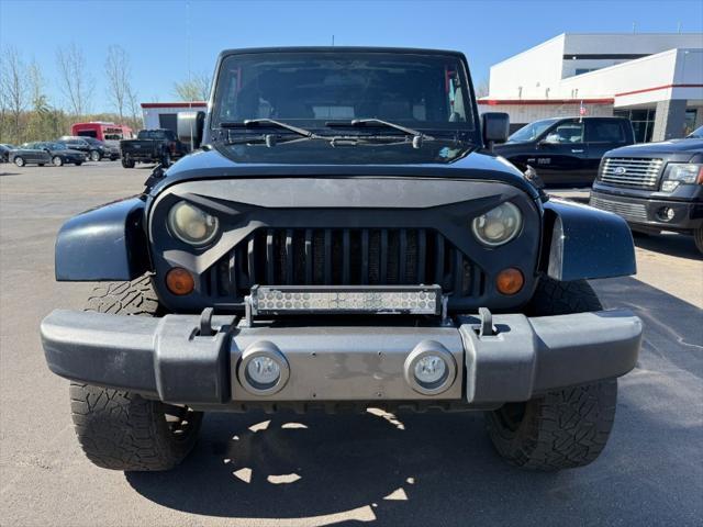 used 2011 Jeep Wrangler Unlimited car, priced at $10,900