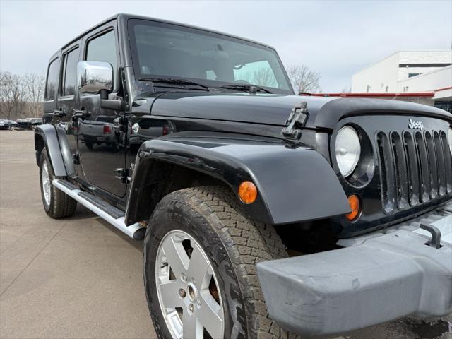 used 2011 Jeep Wrangler Unlimited car, priced at $9,900