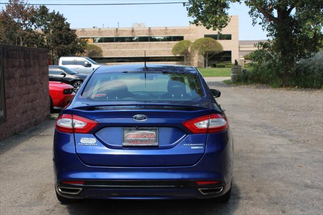 used 2014 Ford Fusion car, priced at $12,499