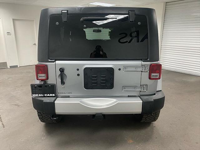 used 2014 Jeep Wrangler Unlimited car, priced at $17,891