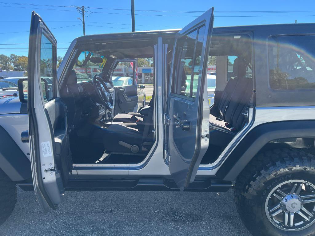 used 2014 Jeep Wrangler Unlimited car, priced at $19,205